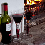 Wine and glasses at the open fireside in Achill Cottages
